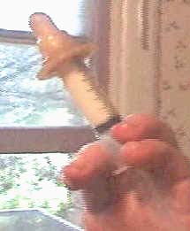 syringe with a baby nipple